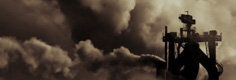 Image:  Chimneys emitting clouds of polution into the atmosphere