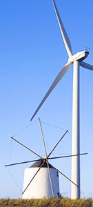 Image:  Old Greek windmill next to modern wind turbine