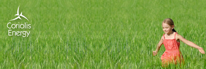 Image:  Girl in a red dress running through a green field